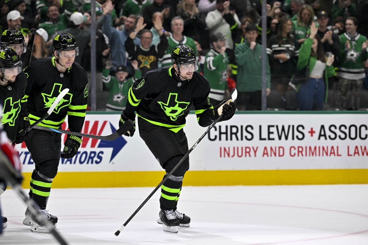 Dec 16, 2024; Dallas, Texas, USA; Dallas Stars center Roope Hintz (24) and defenseman Lian Bichsel (6) skate off the ice after Bichsel scores a goal against the Washington Capitals during the second period at the American Airlines Center. Mandatory Credit: Jerome Miron-Imagn Images