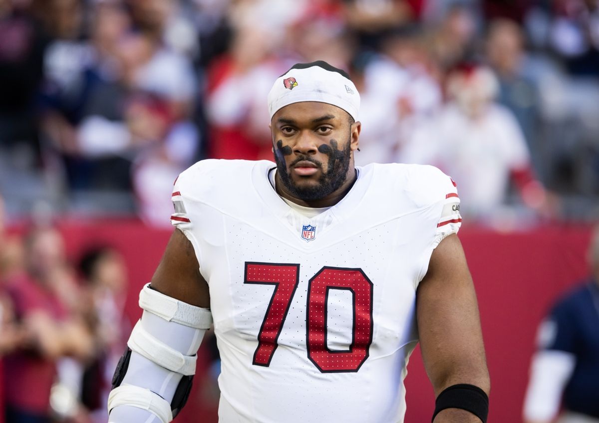 Dec 15, 2024; Glendale, Arizona, USA; Arizona Cardinals offensive tackle Paris Johnson Jr. (70) against the New England Patriots at State Farm Stadium. Mandatory Credit: Mark J. Rebilas-Imagn Images