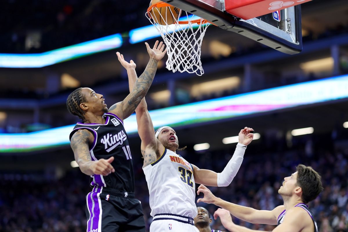 Dec 16, 2024; Sacramento, California, USA; Denver Nuggets forward Aaron Gordon (32) shoots the ball against Sacramento Kings forward DeMar DeRozan (10) during the first quarter at Golden 1 Center. Mandatory Credit: Sergio Estrada-Imagn Images