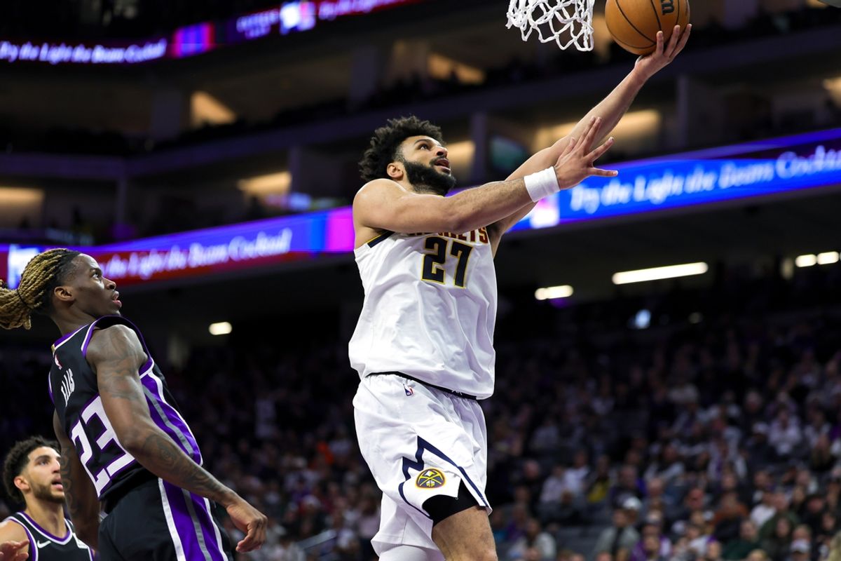 Dec 16, 2024; Sacramento, California, USA; Denver Nuggets guard Jamal Murray (27) drives to the basket against Sacramento Kings guard Keon Ellis (23) during the second quarter at Golden 1 Center. Mandatory Credit: Sergio Estrada-Imagn Images