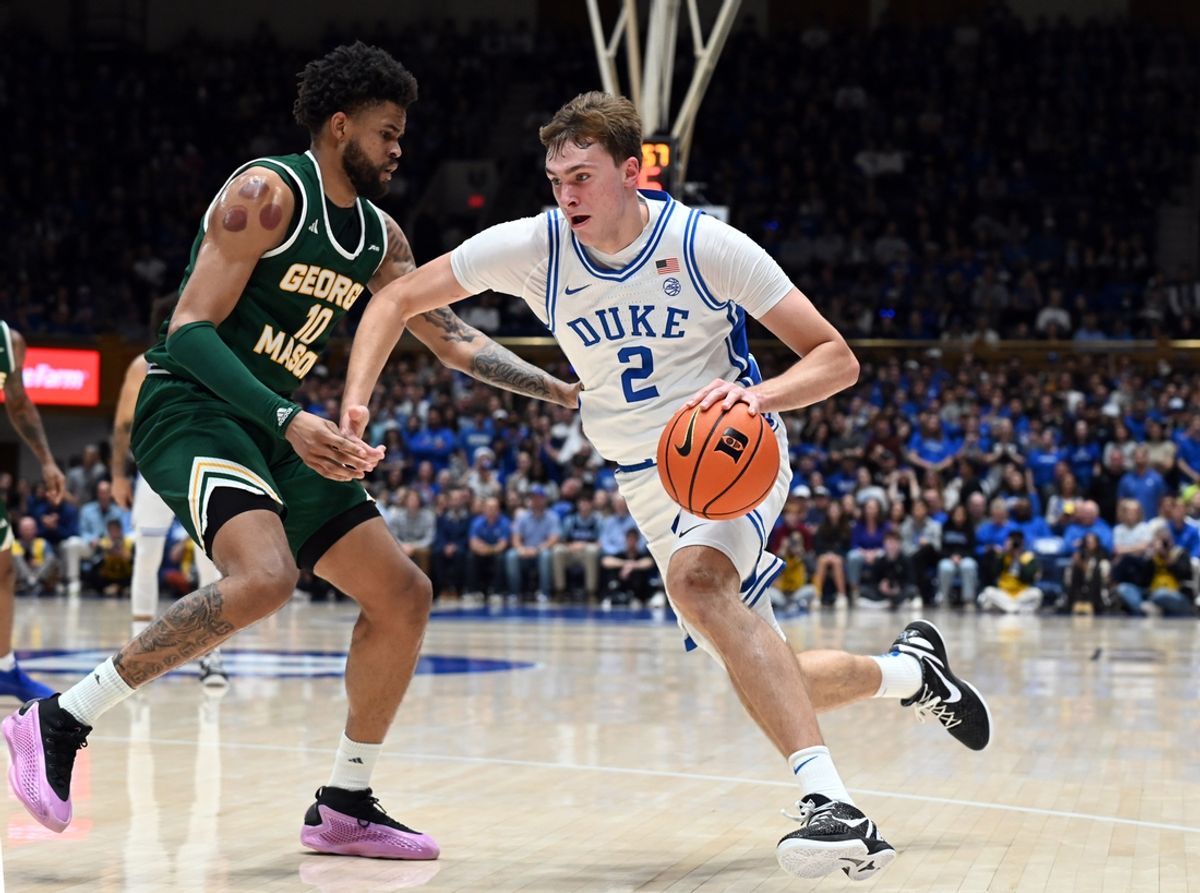 Dec 17, 2024; Durham, North Carolina, USA;Duke Blue Devils forward Cooper Flagg (2) drives to the basket as George Mason Patriots forward Zach Anderson (10) defends during the first half at Cameron Indoor Stadium. Mandatory Credit: Rob Kinnan-Imagn Images