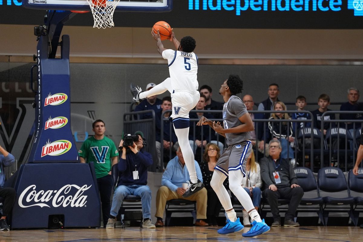 Dec 17, 2024; Villanova, Pennsylvania, USA; Villanova Wildcats guard Wooga Poplar (5) jumps to secure a rebound against the Seton Hall Pirates in the first half at William B. Finneran Pavilion. Mandatory Credit: Kyle Ross-Imagn Images