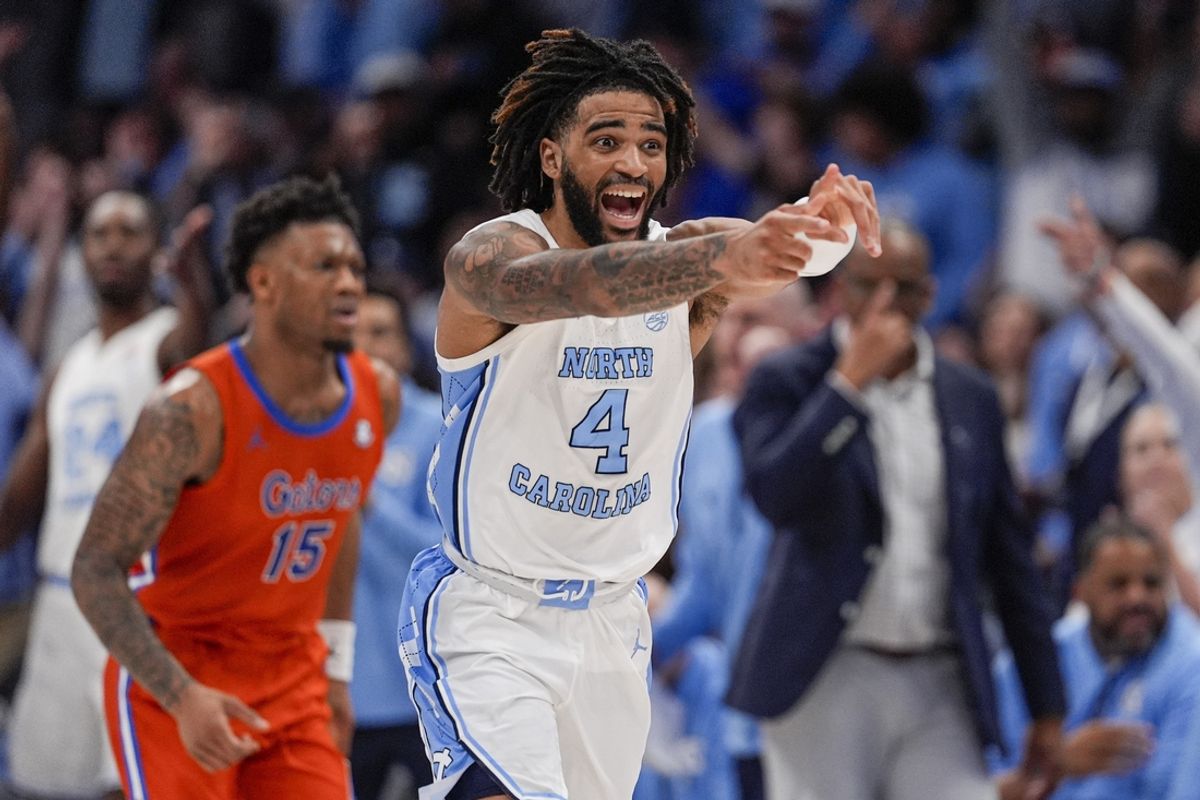 Dec 17, 2024; Charlotte, North Carolina, USA;  North Carolina Tar Heels guard RJ Davis (4) reacts to his three point play against the Florida Gators during the second half at Spectrum Center. Mandatory Credit: Jim Dedmon-Imagn Images