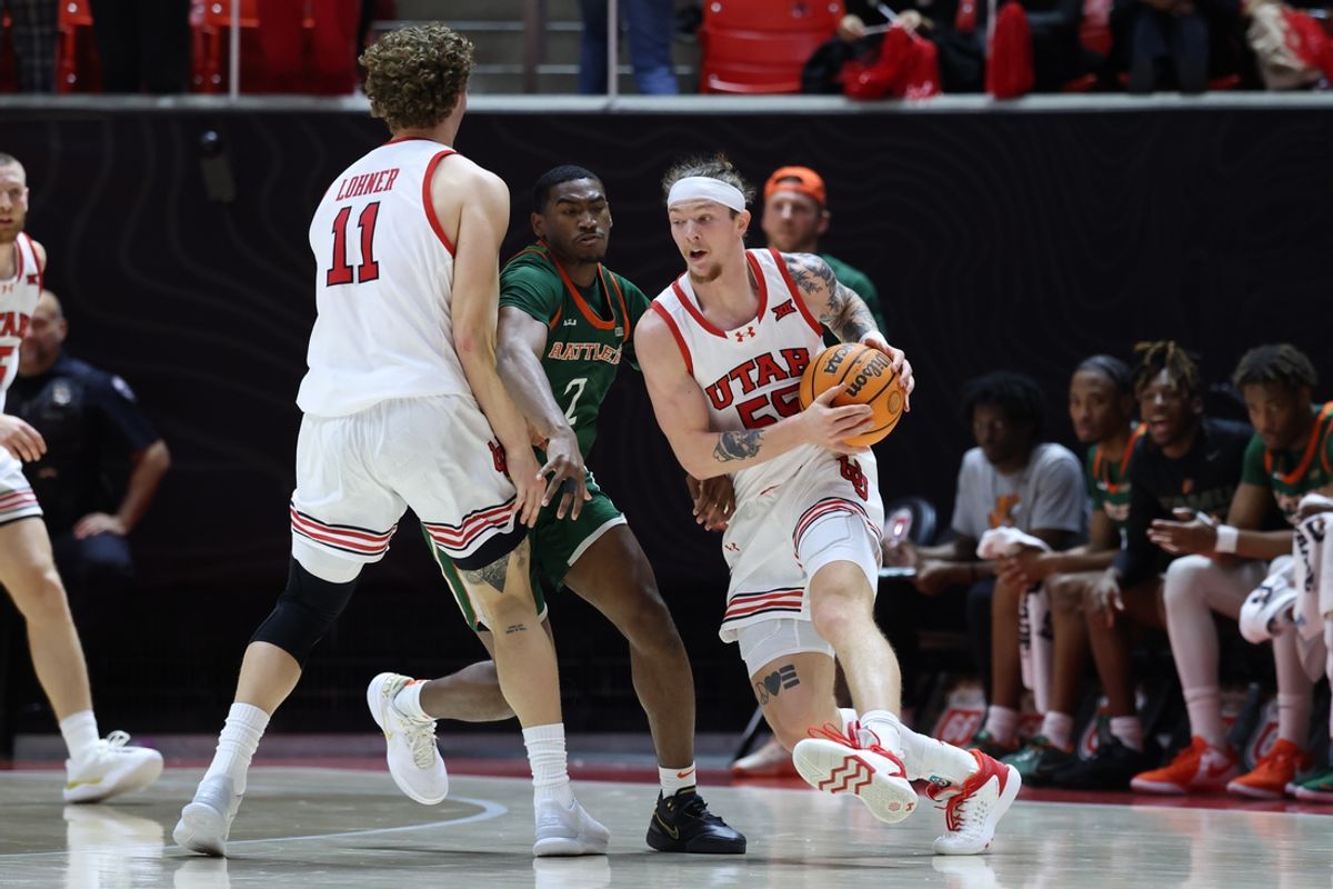 Dec 17, 2024; Salt Lake City, Utah, USA; Utah Utes guard Gabe Madsen (55) uses a screen by forward Caleb Lohner (11) against Florida A&M Rattlers guard Jordan Chatman (2) during the first half at Jon M. Huntsman Center. Mandatory Credit: Rob Gray-Imagn Images