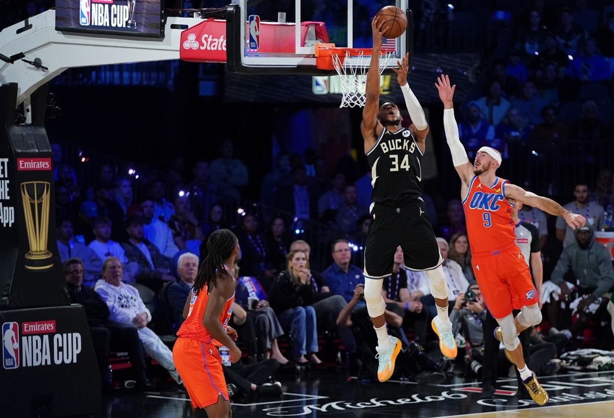 Dec 17, 2024; Las Vegas, Nevada, USA; Milwaukee Bucks forward Giannis Antetokounmpo (34) shoots against Oklahoma City Thunder guard Alex Caruso (9) during the 2nd quarter of the Emirates NBA Cup championship game at T-Mobile Arena. Mandatory Credit: Kyle Terada-Imagn Images
