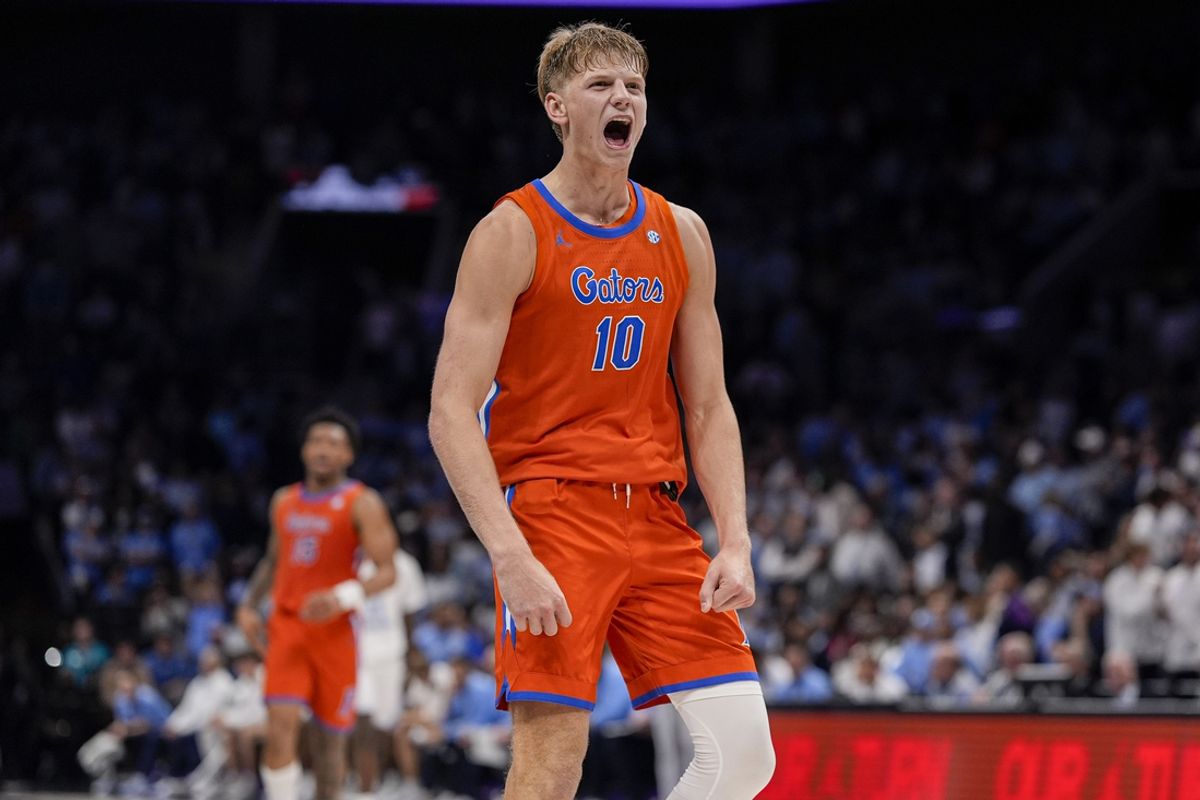 Dec 17, 2024; Charlotte, North Carolina, USA; Florida Gators forward Thomas Haugh (10) reacts to the go ahead score against the North Carolina Tar Heels during the second half at Spectrum Center. Mandatory Credit: Jim Dedmon-Imagn Images
