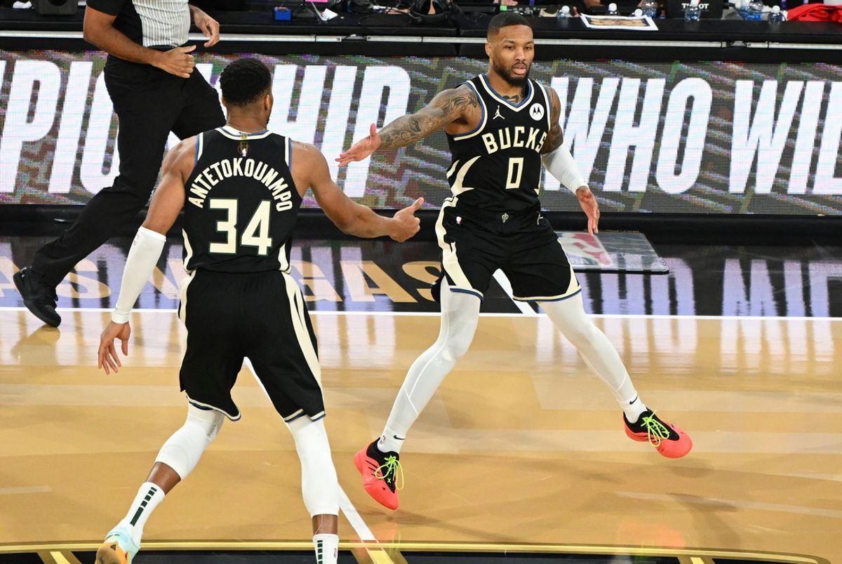Dec 17, 2024; Las Vegas, Nevada, USA; Milwaukee Bucks guard Damian Lillard (0) and forward Giannis Antetokounmpo (34) celebrate after a play during the 3rd quarter of the Emirates NBA Cup championship game against the Oklahoma City Thunder at T-Mobile Arena. Mandatory Credit: Candice Ward-Imagn Images