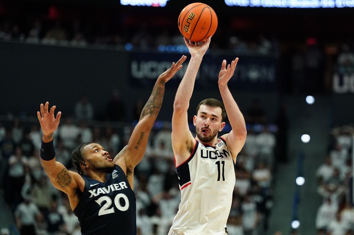 Dec 18, 2024; Storrs, Connecticut, USA; UConn Huskies forward Alex Karaban (11) shoots against Xavier Musketeers guard Dayvion McKnight (20) in the second half at Harry A. Gampel Pavilion. Mandatory Credit: David Butler II-Imagn Images