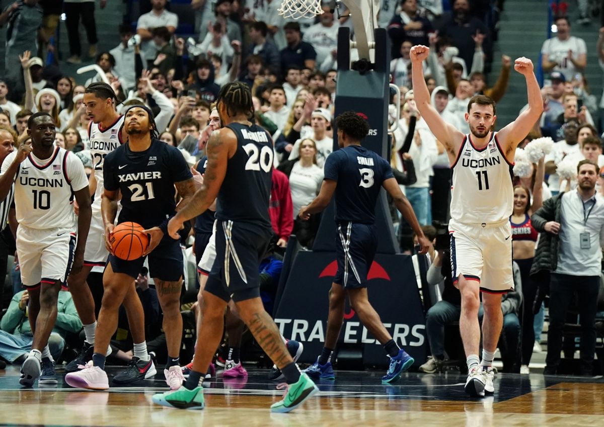 Dec 18, 2024; Storrs, Connecticut, USA; UConn Huskies forward Alex Karaban (11) reacts after defeating the Xavier Musketeers in overtime at Harry A. Gampel Pavilion. Mandatory Credit: David Butler II-Imagn Images