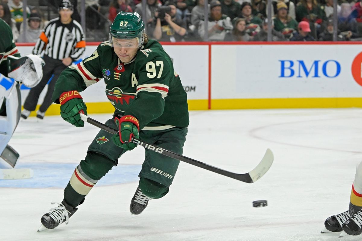 Dec 15, 2024; Saint Paul, Minnesota, USA;  Minnesota Wild forward Kirill Kaprizov (97) makes a pass against The Vegas Golden Knights during the third period at Xcel Energy Center. Mandatory Credit: Nick Wosika-Imagn Images