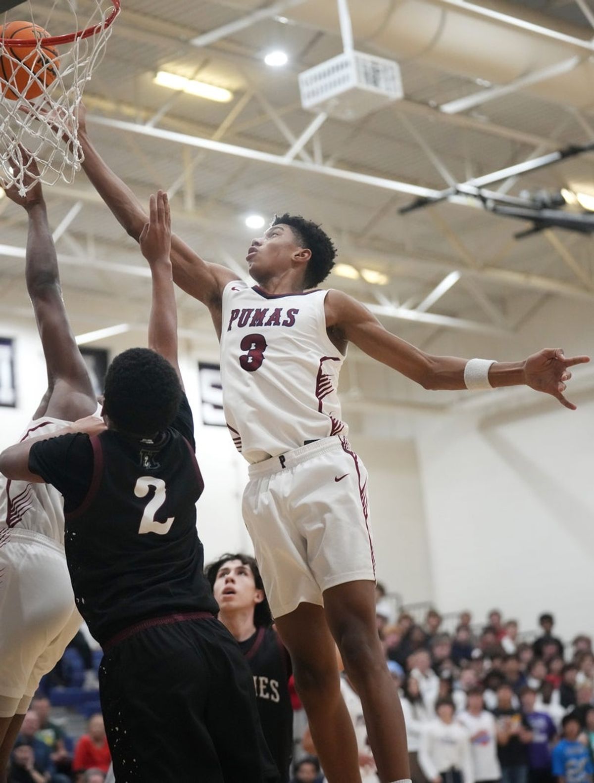 Perry Pumas forward Bruce Branch III (3) shoots the ball over Hamilton Huskies guard Davion Harris (2) at Perry High School in Gilbert on Dec. 18, 2024.