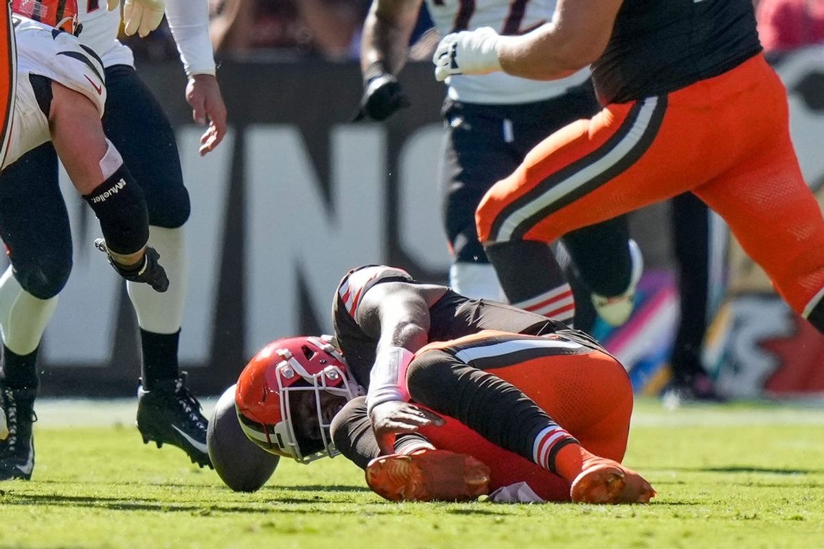 Cleveland Browns quarterback Deshaun Watson (4) goes down with a non-contact injury to his lower leg in the second quarter of the NFL Week 7 game between the Cleveland Browns and the Cincinnati Bengals at Huntington Bank Field in downtown Cleveland on Sunday, Oct. 20, 2024.