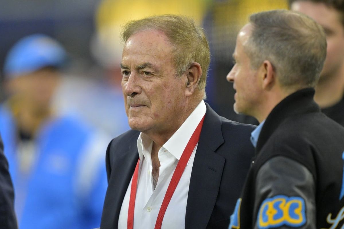 Dec 19, 2024; Inglewood, California, USA;  Sportscaster Al Michaels talks with Los Angeles Chargers President of football operations John Spanos prior to the game against the Denver Broncos at SoFi Stadium. Mandatory Credit: Jayne Kamin-Oncea-Imagn Images