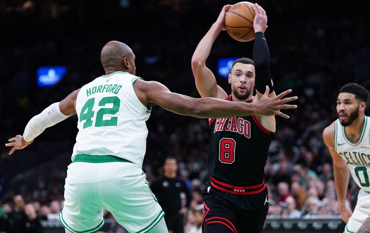 Dec 19, 2024; Boston, Massachusetts, USA; Chicago Bulls guard Zach LaVine (8) drives the ball against Boston Celtics center Al Horford (42) and forward Jayson Tatum (0) in the second half at TD Garden. Mandatory Credit: David Butler II-Imagn Images