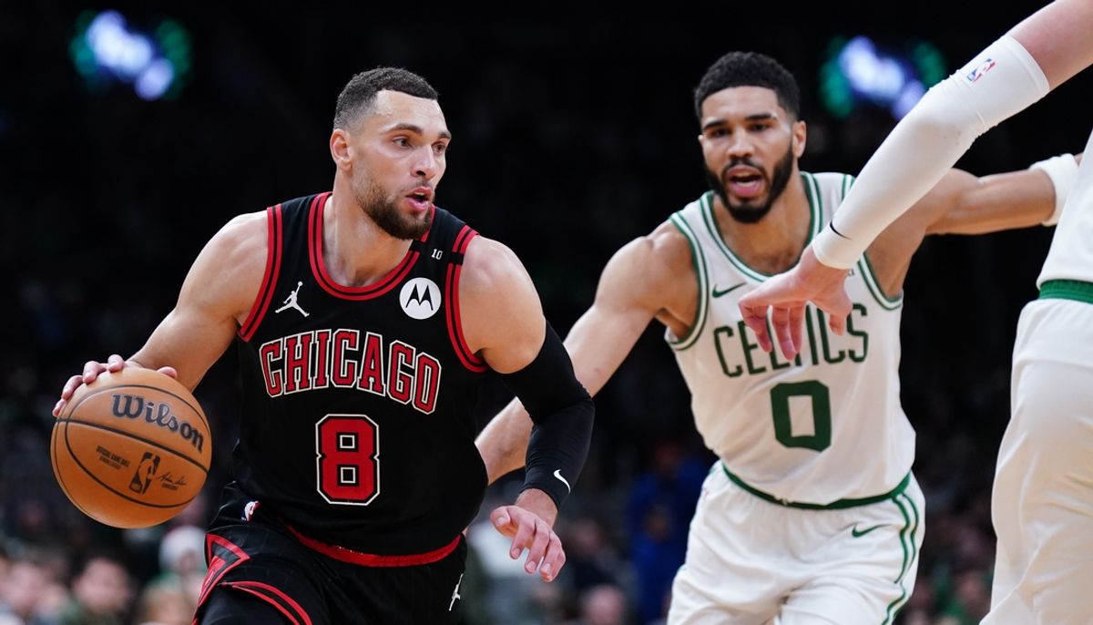 Dec 19, 2024; Boston, Massachusetts, USA; Chicago Bulls guard Zach LaVine (8) drives the ball against Boston Celtics forward Jayson Tatum (0) in the second half at TD Garden. Mandatory Credit: David Butler II-Imagn Images