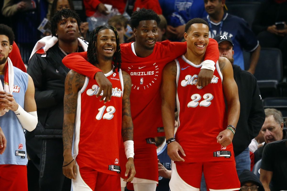 Dec 19, 2024; Memphis, Tennessee, USA; Memphis Grizzlies guard Ja Morant (left), forward Jaren Jackson Jr. (middle) and guard Desmond Bane (right) react during the fourth quarter against the Golden State Warriors at FedExForum. Mandatory Credit: Petre Thomas-Imagn Images