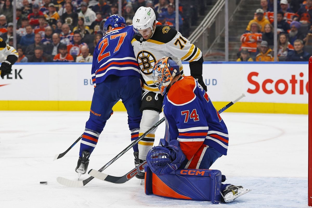 Dec 19, 2024; Edmonton, Alberta, CAN; Boston Bruins forward Oliver Wahlstrom (71) looks for a loose puck in front of Edmonton Oilers goaltender Stuart Skinner (74)during the second period at Rogers Place. Mandatory Credit: Perry Nelson-Imagn Images