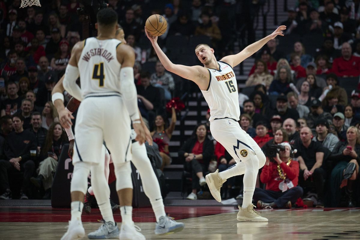 Dec 19, 2024; Portland, Oregon, USA; Denver Nuggets center Nikola Jokic (15) catches a pass during the first half against the Portland Trail Blazers at Moda Center. Mandatory Credit: Troy Wayrynen-Imagn Images