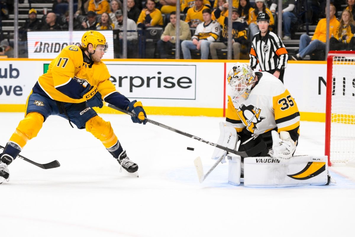 Dec 19, 2024; Nashville, Tennessee, USA;  Pittsburg Penguins goaltender Tristan Jarry (35) blocks the shot of Nashville Predators center Mark Jankowski (17) during the third period at Bridgestone Arena. Mandatory Credit: Steve Roberts-Imagn Images