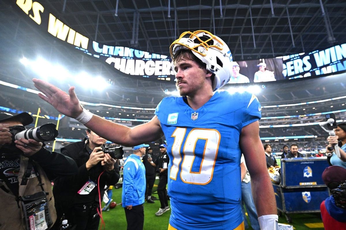 Dec 19, 2024; Inglewood, California, USA;  Los Angeles Chargers quarterback Justin Herbert (10) celebrates as he leaves the field after defeating the Denver Broncos at SoFi Stadium. Mandatory Credit: Jayne Kamin-Oncea-Imagn Images