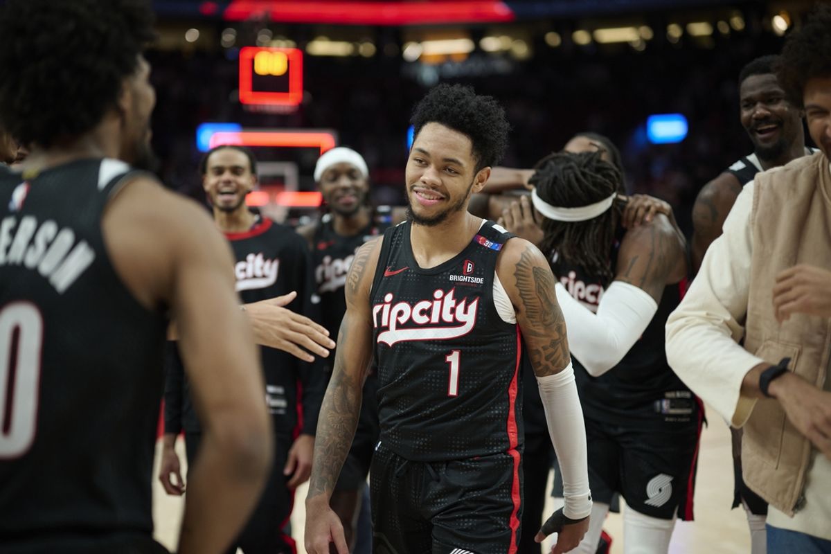 Dec 19, 2024; Portland, Oregon, USA; Portland Trail Blazers guard Anfernee Simons (1) celebrates with teammates after scoring the game winning shot against the Denver Nuggets at Moda Center. Mandatory Credit: Troy Wayrynen-Imagn Images
