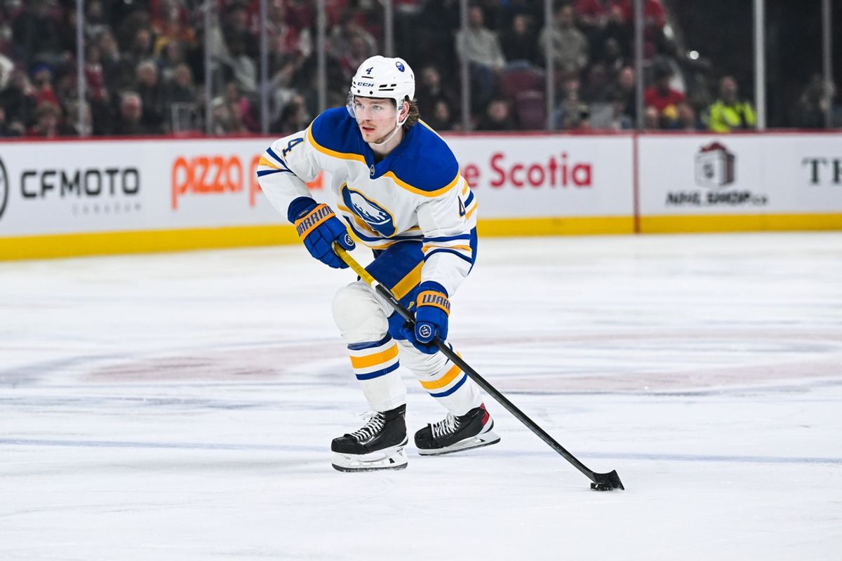 Dec 17, 2024; Montreal, Quebec, CAN; Buffalo Sabres defenseman Bowen Byram (4) plays the puck against the Montreal Canadiens during the third period at Bell Centre. Mandatory Credit: David Kirouac-Imagn Images