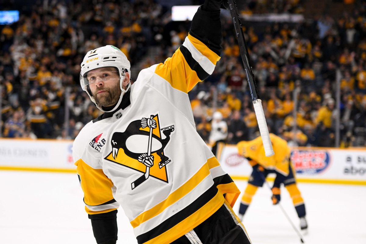 Dec 19, 2024; Nashville, Tennessee, USA;  Pittsburgh Penguins right wing Bryan Rust (17) celebrates the game winner against the Nashville Predators during the 1st overtime period at Bridgestone Arena. Mandatory Credit: Steve Roberts-Imagn Images