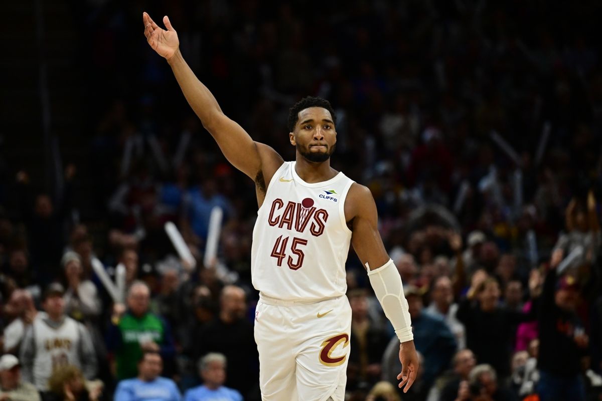 Dec 20, 2024; Cleveland, Ohio, USA; Cleveland Cavaliers guard Donovan Mitchell (45) celebrates after hitting a three point basket during the second half against the Milwaukee Bucks at Rocket Mortgage FieldHouse. Mandatory Credit: Ken Blaze-Imagn Images