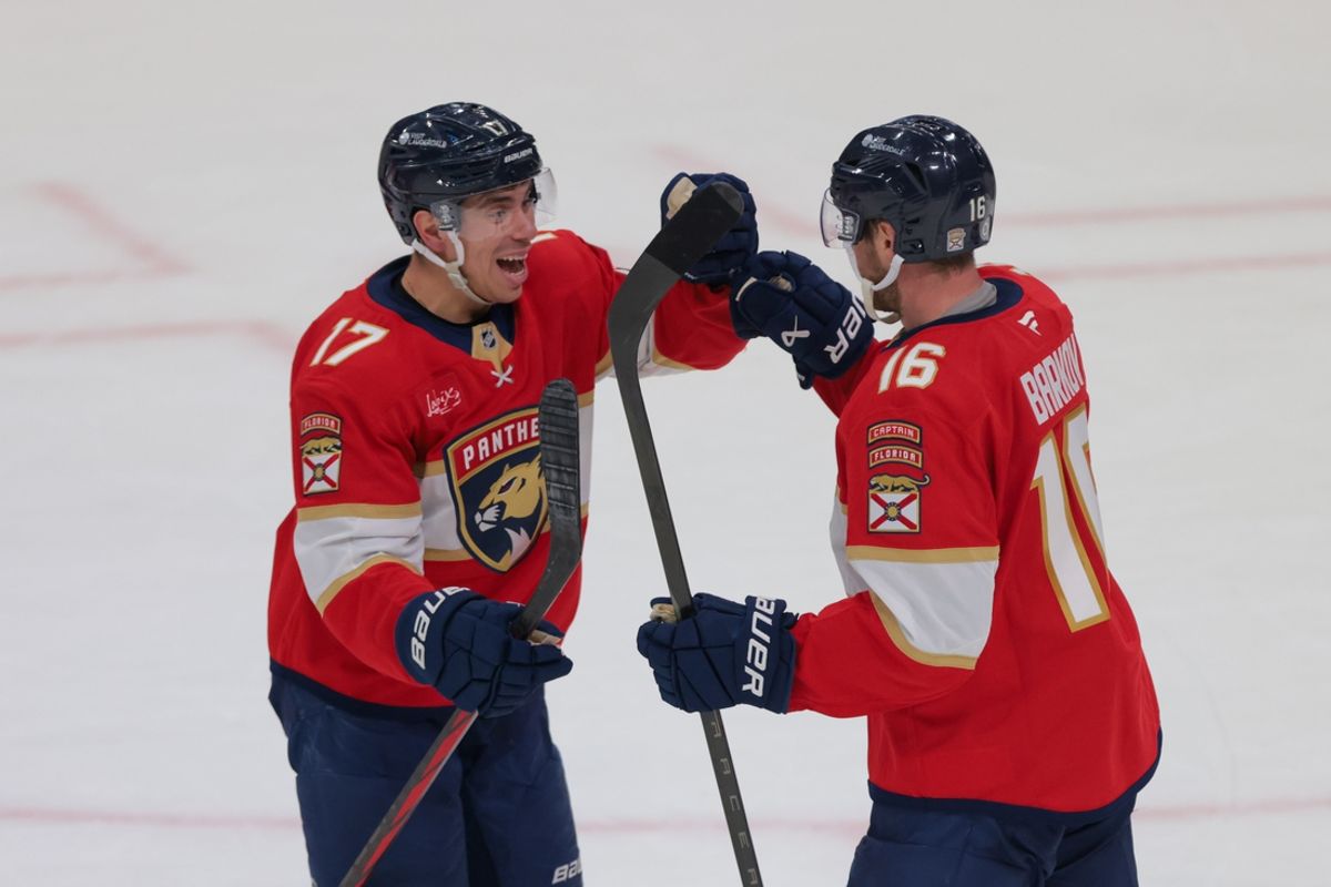 Dec 20, 2024; Sunrise, Florida, USA; Florida Panthers center Aleksander Barkov (16) celebrates with center Evan Rodrigues (17) after scoring the game-winning goal against the St. Louis Blues during overtime at Amerant Bank Arena. Mandatory Credit: Sam Navarro-Imagn Images