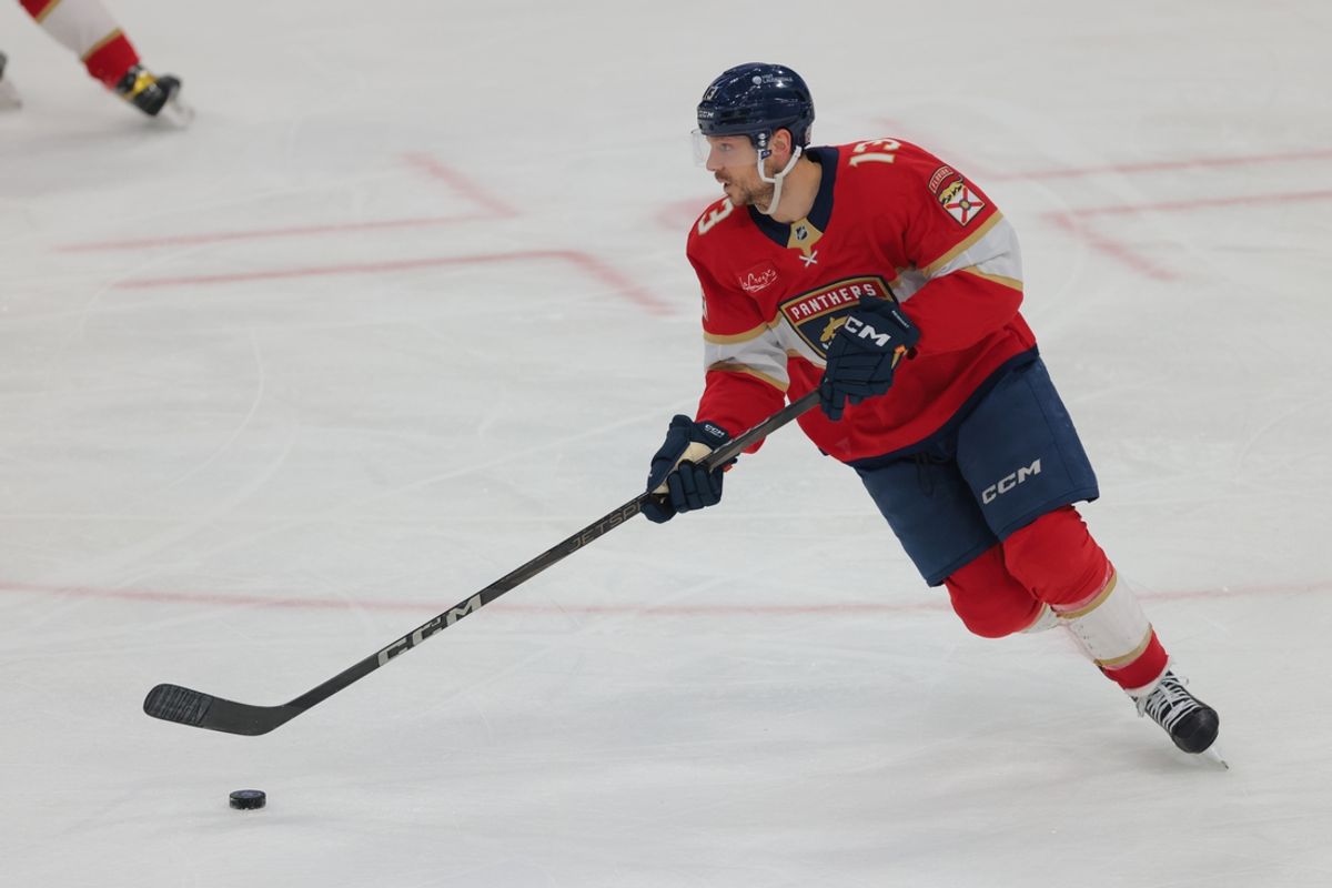 Dec 20, 2024; Sunrise, Florida, USA; Florida Panthers center Sam Reinhart (13) moves the puck against the St. Louis Blues during the third period at Amerant Bank Arena. Mandatory Credit: Sam Navarro-Imagn Images
