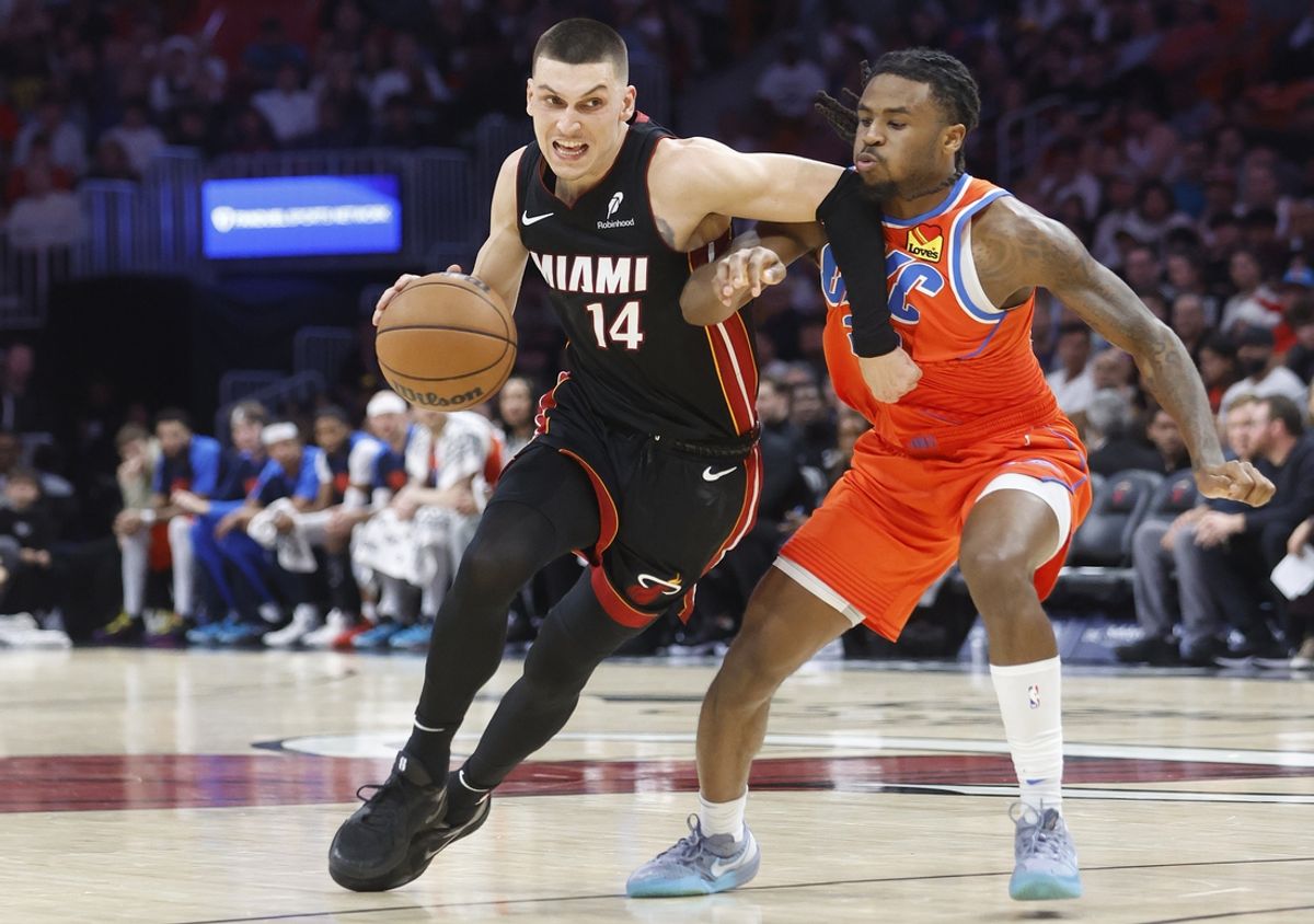 Dec 20, 2024; Miami, Florida, USA;  Oklahoma City Thunder guard Cason Wallace (22) defends Miami Heat guard Tyler Herro (14) during the second half at Kaseya Center. Mandatory Credit: Rhona Wise-Imagn Images