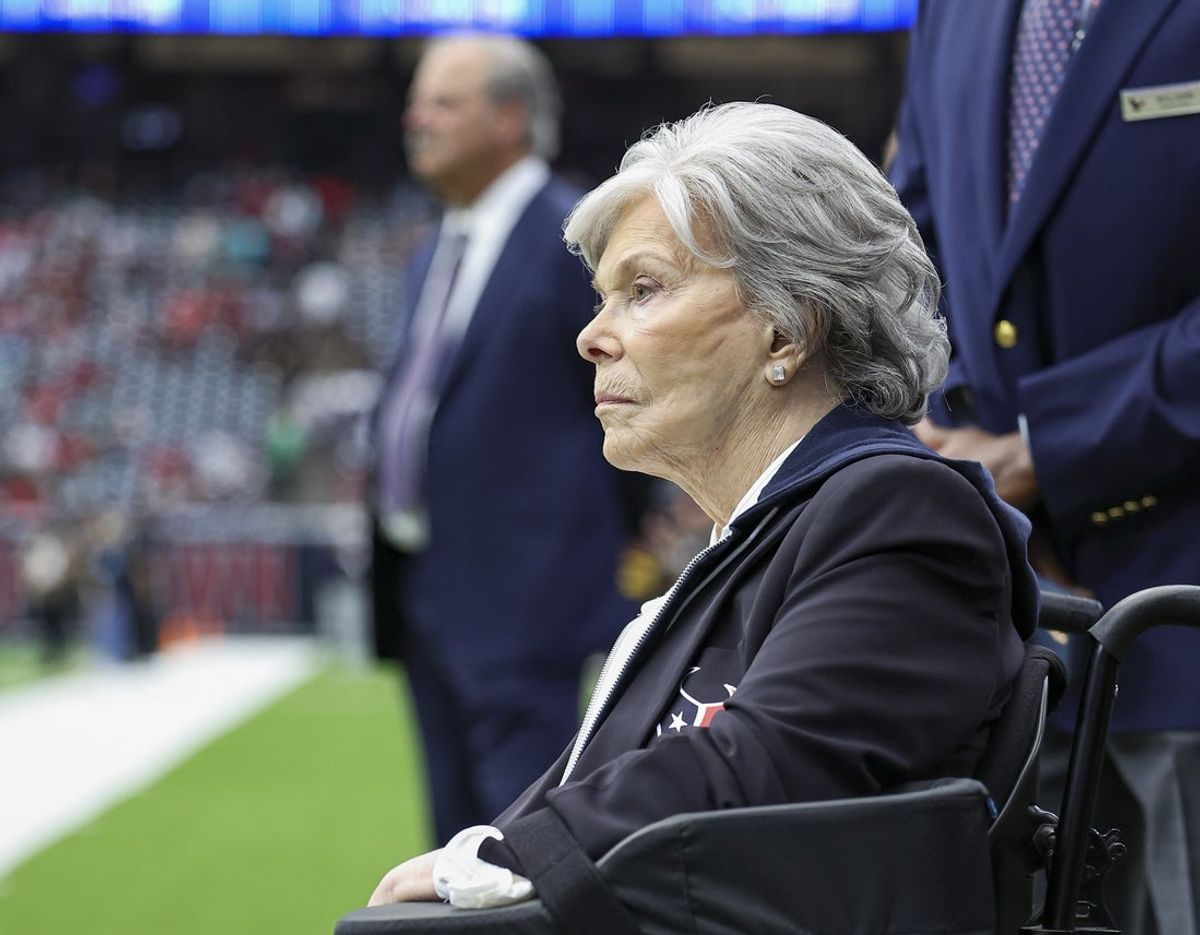 Dec 15, 2024; Houston, Texas, USA; Houston Texans co-founder and former owner Janice McNair looks on with son and Texans chief executive officer Cal McNair in the background before a game against the Miami Dolphins at NRG Stadium. Mandatory Credit: Troy Taormina-Imagn Images