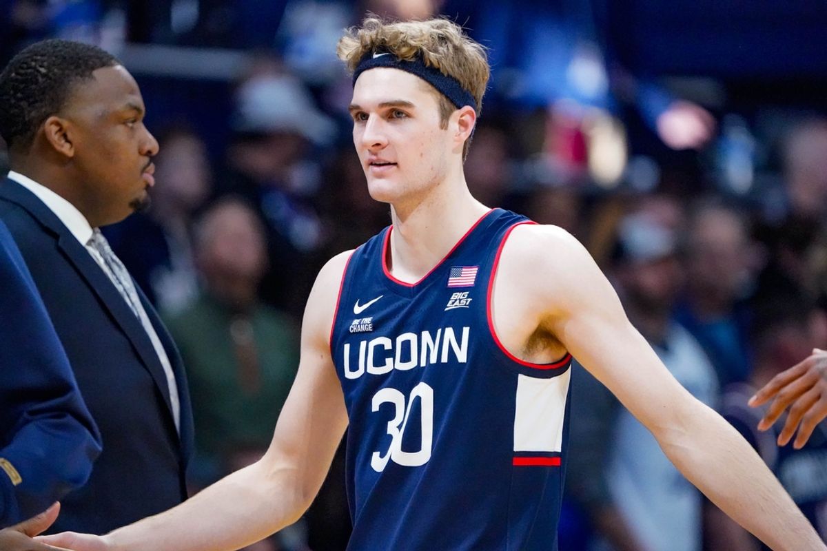 Liam McNeeley (30) celebrates a basket during game between the Butler Bulldogs and the University of Connecticut Husks at Hinkle Fieldhouse on Saturday, Dec. 21, 2024, in Indianapolis.