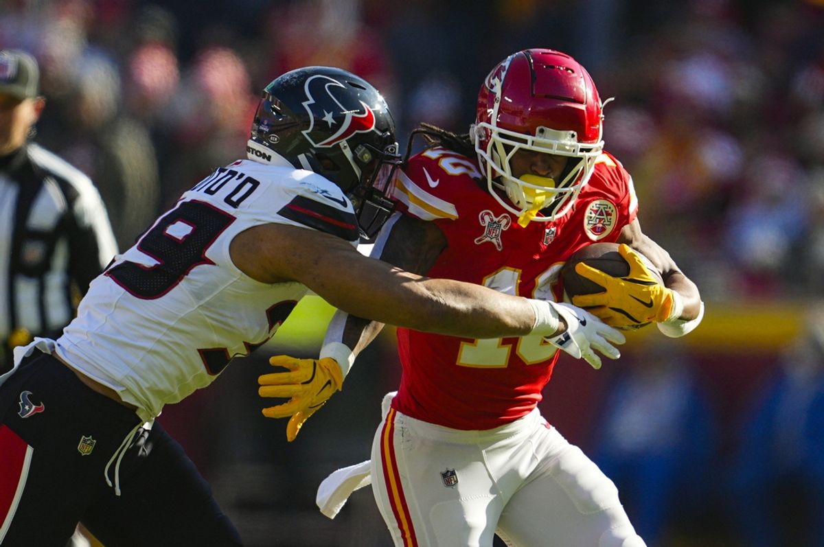 Dec 21, 2024; Kansas City, Missouri, USA; Kansas City Chiefs running back Isiah Pacheco (10) runs the ball against Houston Texans linebacker Henry To'oTo'o (39) during the first half at GEHA Field at Arrowhead Stadium. Mandatory Credit: Jay Biggerstaff-Imagn Images
