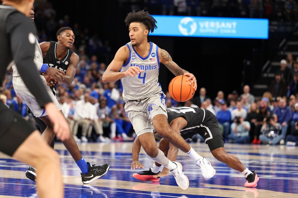 Dec 21, 2024; Memphis, Tennessee, USA; Memphis Tigers guard PJ Haggerty (4) drives to the basket against the Mississippi State Bulldogs during the first half at FedExForum. Mandatory Credit: Wesley Hale-Imagn Images