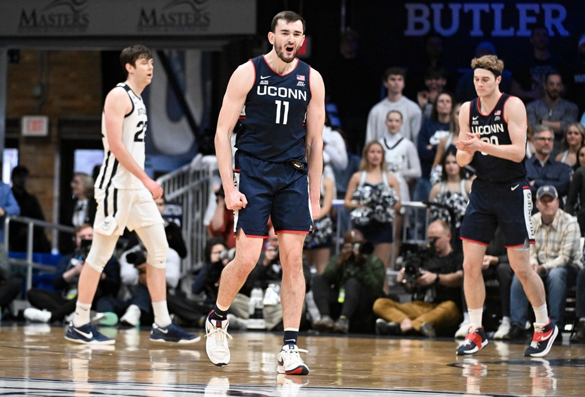 Dec 21, 2024; Indianapolis, Indiana, USA; Connecticut Huskies forward Alex Karaban (11) celebrates after a play during the second half against the Butler Bulldogs at Hinkle Fieldhouse. Mandatory Credit: Robert Goddin-Imagn Images