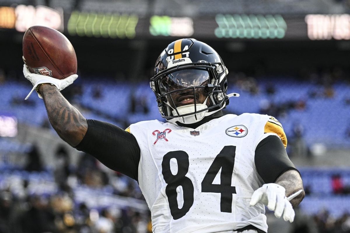 Dec 21, 2024; Baltimore, Maryland, USA;  Pittsburgh Steelers running back Cordarrelle Patterson (84) throws the ball to fans before the game against the Baltimore Ravens at M&T Bank Stadium. Mandatory Credit: Tommy Gilligan-Imagn Images