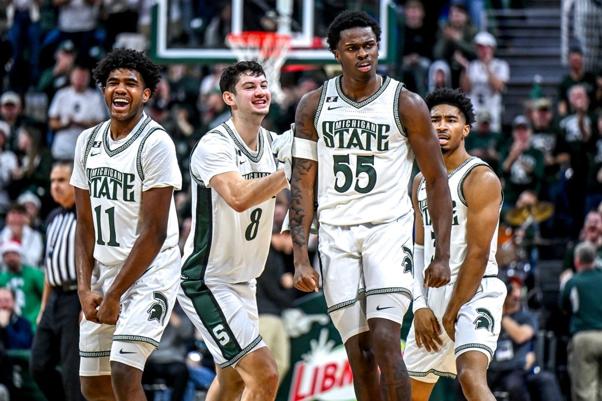 Michigan State's Coen Carr, center, celebrates with, from left, Jase Richardson, Frankie Fidler and Jaden Akins after Carr's 3-pointer against Florida Atlantic during the second half on Saturday, Dec. 21, 2024, in East Lansing.