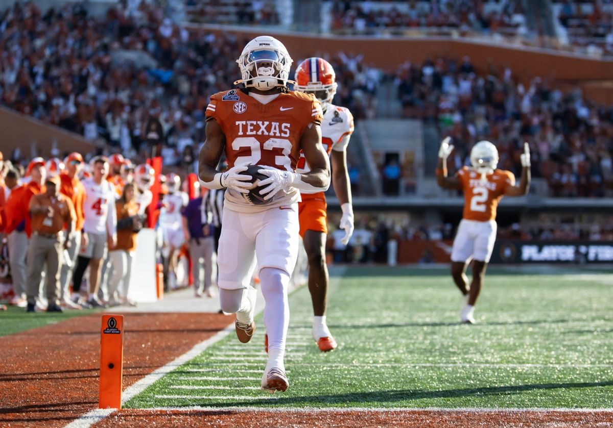 Dec 21, 2024; Austin, Texas, USA; Texas Longhorns running back Jaydon Blue (23) scores a touchdown against the Clemson Tigers during the first half of the CFP National playoff first round at Darrell K Royal-Texas Memorial Stadium. Mandatory Credit: Mark J. Rebilas-Imagn Imagesn Images