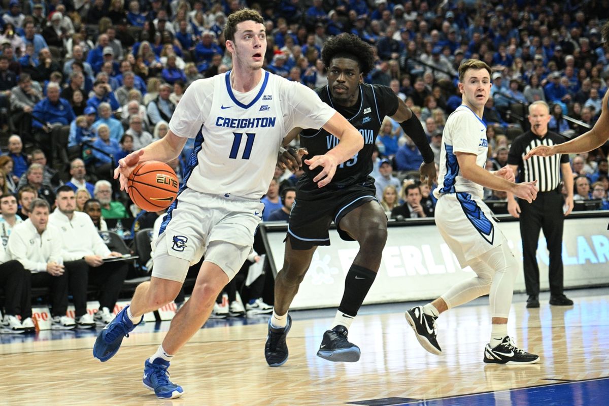 Dec 21, 2024; Omaha, Nebraska, USA;  Creighton Bluejays center Ryan Kalkbrenner (11) drives to the basket against Villanova Wildcats forward Enoch Boakye (13) in the second half at CHI Health Center Omaha. Mandatory Credit: Steven Branscombe-Imagn Images