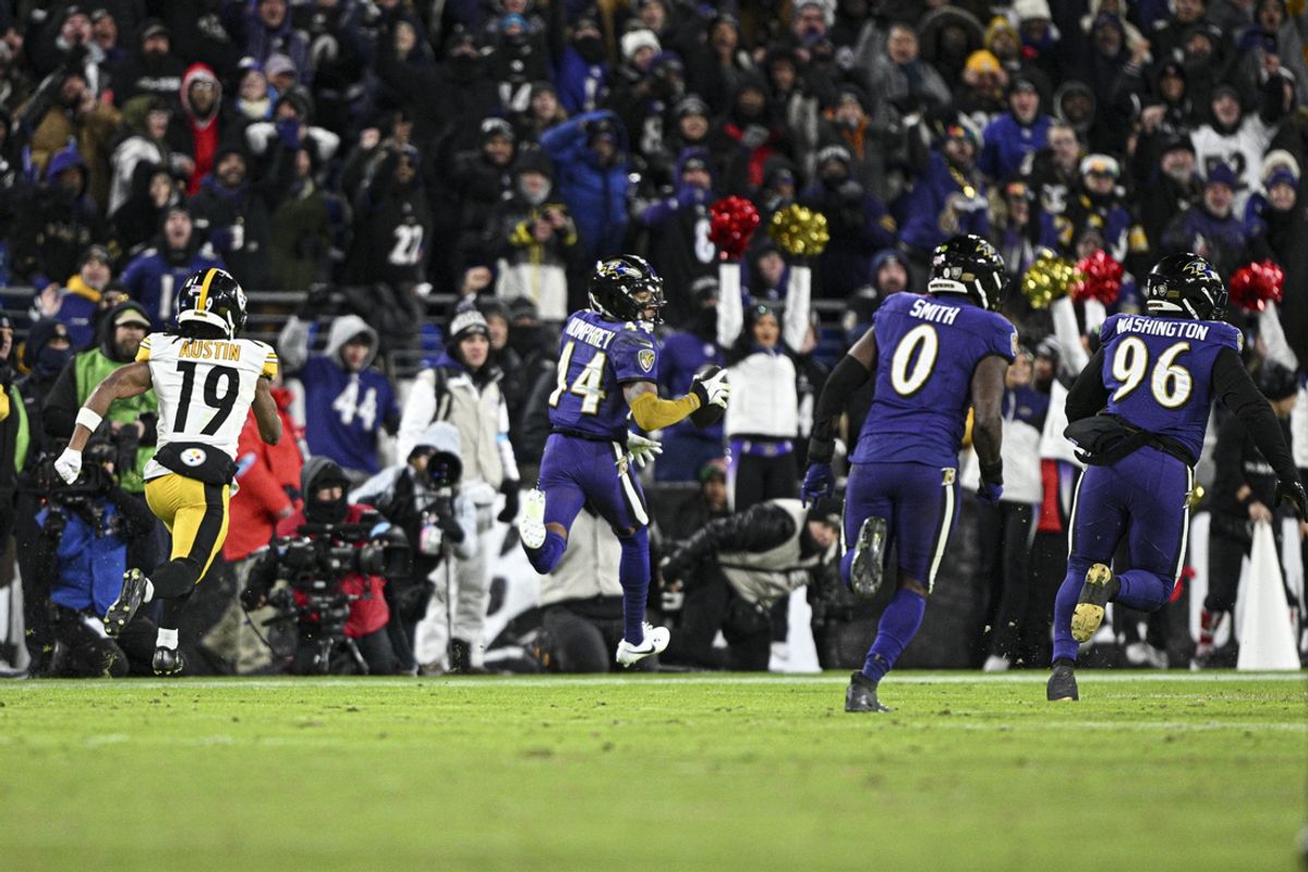 Dec 21, 2024; Baltimore, Maryland, USA;  Baltimore Ravens cornerback Marlon Humphrey (44) returns a interception for a touchdown  during the second half against the Pittsburgh Steelers at M&T Bank Stadium. Mandatory Credit: Tommy Gilligan-Imagn Images