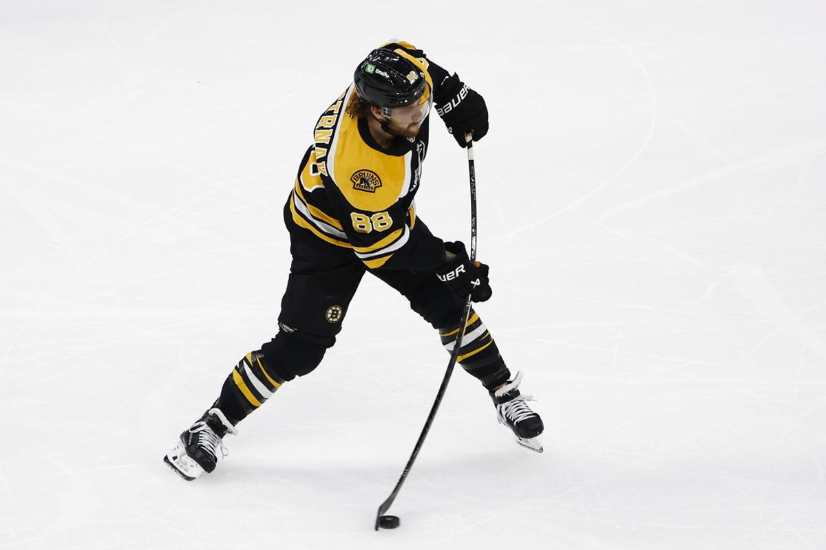 Dec 21, 2024; Boston, Massachusetts, USA; Boston Bruins right wing David Pastrnak (88) lets go with a shot against the Buffalo Sabres during the first period at TD Garden. Mandatory Credit: Winslow Townson-Imagn Images