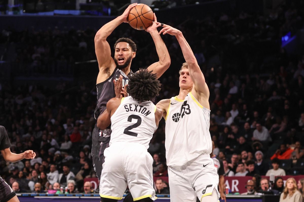 Dec 21, 2024; Brooklyn, New York, USA;  Brooklyn Nets guard Ben Simmons (10) controls the ball against Utah Jazz guard Collin Sexton (2) and forward Lauri Markkanen (23) in the second quarter at Barclays Center. Mandatory Credit: Wendell Cruz-Imagn Images