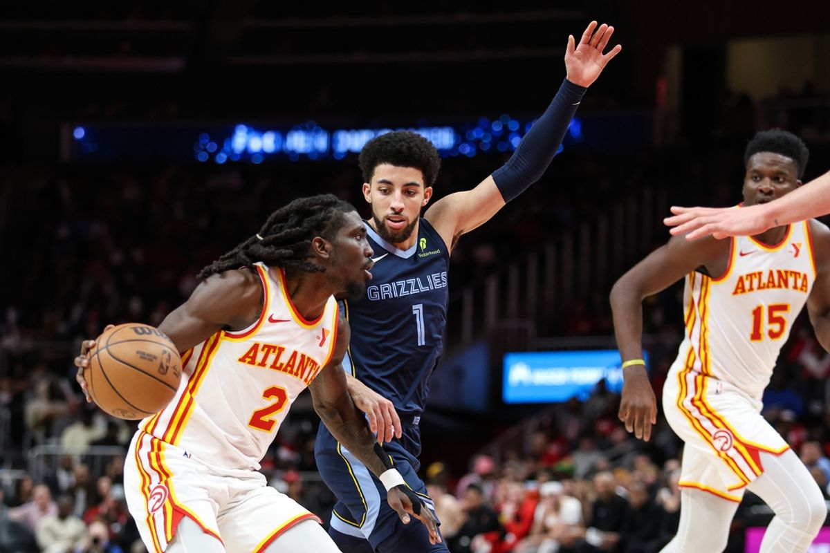 Dec 21, 2024; Atlanta, Georgia, USA; Memphis Grizzlies guard Scotty Pippen Jr. (1) plays defense against Atlanta Hawks guard Keaton Wallace (2) during the first half at State Farm Arena. Mandatory Credit: Jordan Godfree-Imagn Images