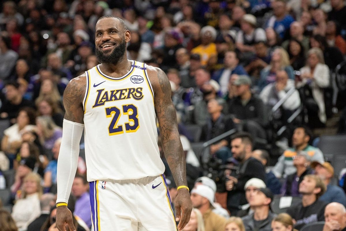 Dec 21, 2024; Sacramento, California, USA; Los Angeles Lakers forward LeBron James (23) smiles after his team scored against the Sacramento Kings during the fourth quarter at Golden 1 Center. Mandatory Credit: Ed Szczepanski-Imagn Images