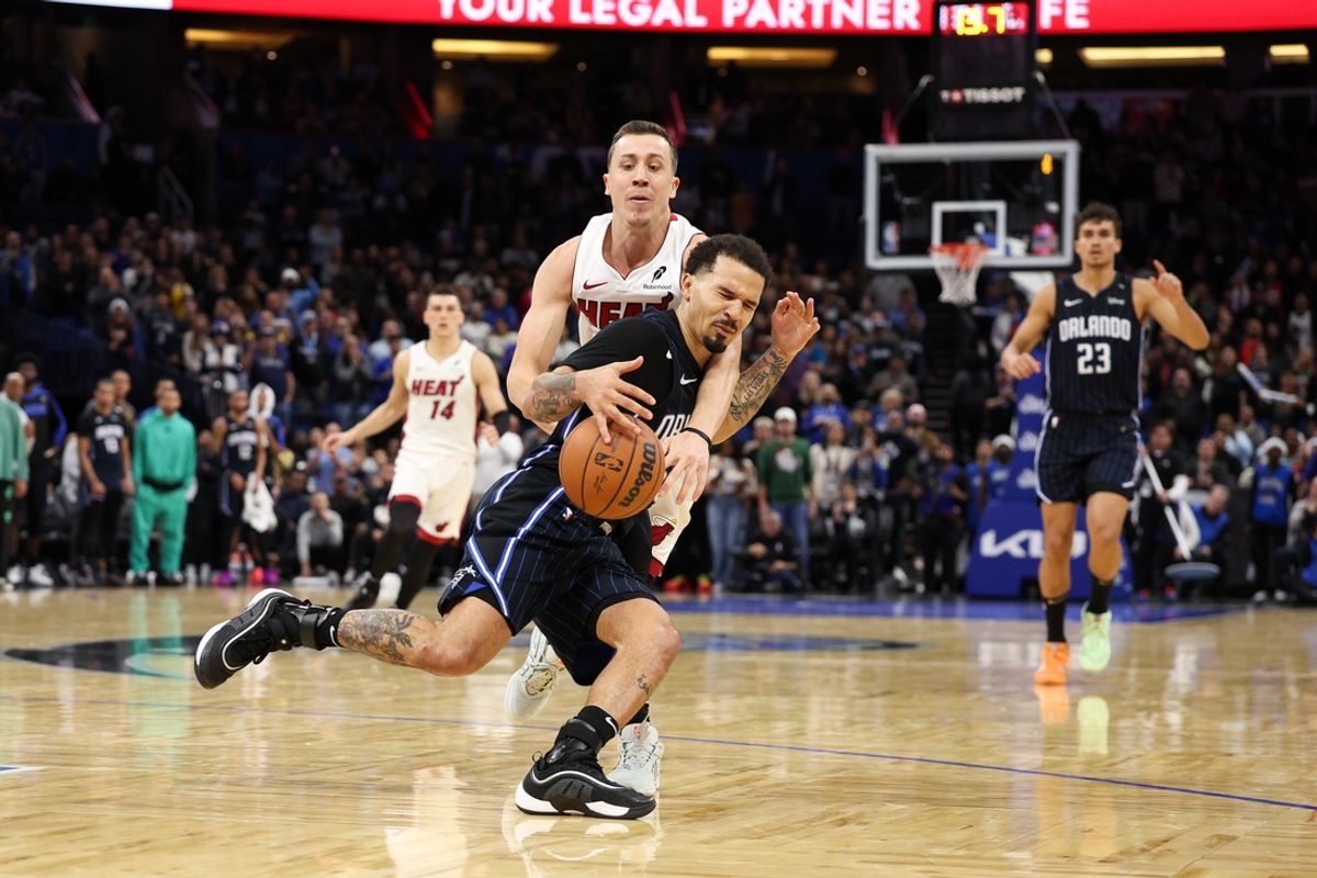 Dec 21, 2024; Orlando, Florida, USA; Orlando Magic guard Cole Anthony (50) is fouled by Miami Heat forward Duncan Robinson (55) in the fourth quarter  at Kia Center. Mandatory Credit: Nathan Ray Seebeck-Imagn Images