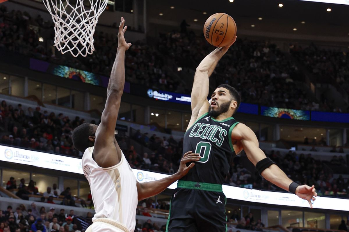 Dec 21, 2024; Chicago, Illinois, USA; Boston Celtics forward Jayson Tatum (0) goes to the basket against Chicago Bulls forward Jalen Smith (7) during the second half at United Center. Mandatory Credit: Kamil Krzaczynski-Imagn Images