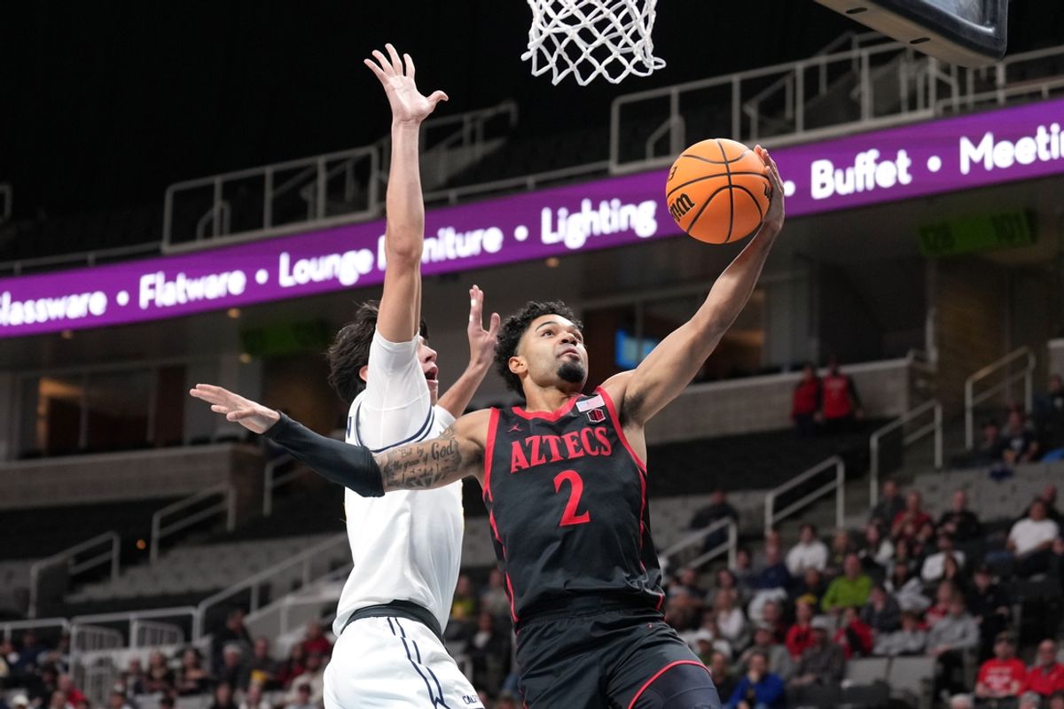 Dec 21, 2024; San Jose, California, USA; San Diego State Aztecs guard Nick Boyd (2) shoots against California Golden Bears guard Andrej Stojakovic (left) during the first half at SAP Center. Mandatory Credit: Darren Yamashita-Imagn Images