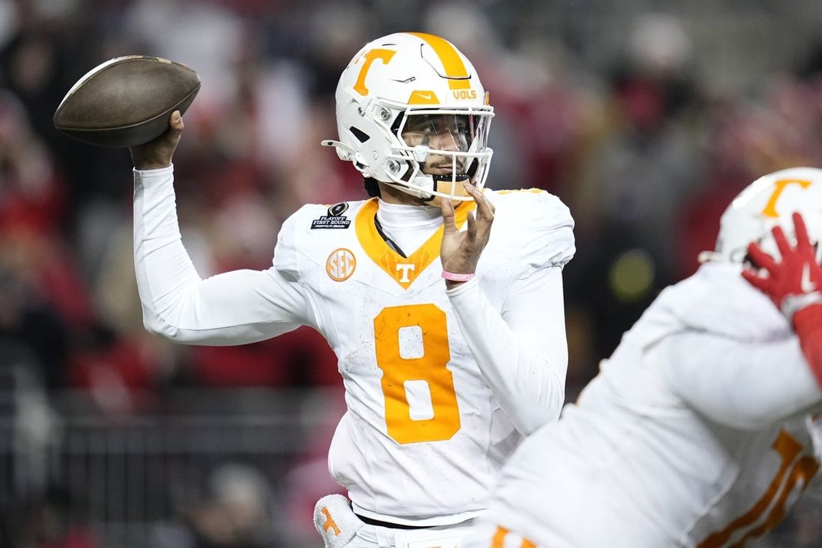Dec 21, 2024; Columbus, Ohio, USA; Tennessee Volunteers quarterback Nico Iamaleava (8) throws against the Ohio State Buckeyes during the second half of the College Football Playoff first round game at Ohio Stadium. Ohio State won 42-17. Mandatory Credit: Adam Cairns-Imagn Images