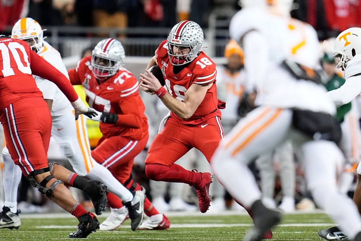 Ohio State Buckeyes quarterback Will Howard (18) rushes during the second half of the College Football Playoff first round game against the Tennessee Volunteers at Ohio Stadium in Columbus on Dec. 22, 2024. Ohio State won 42-17.